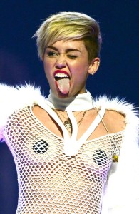 Miley Cyrus wearing provactive clothing.
